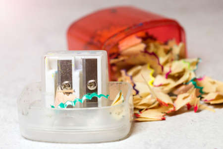 Pencil sharpener and colored shavingsの写真素材