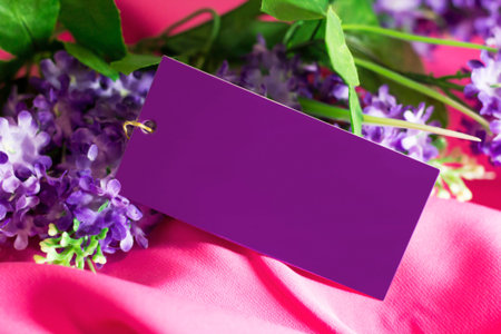 Price tag, pink jacket and flowersの写真素材