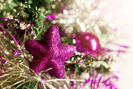 Lilac shiny star on the Christmas treeの写真素材