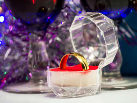 Wedding rings on the background of holiday decorations.の写真素材