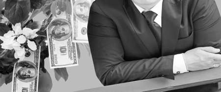 Businessman on the background of money on a tree, black and white photoの写真素材
