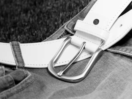 Leather belt on jeans. Black and white photo. Selective focus.の写真素材