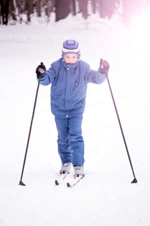 Little boy skiing with sticks, children's sportの写真素材