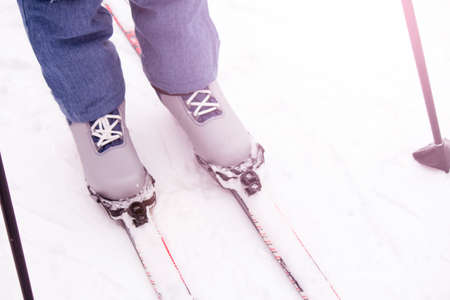 Feet in ski boots on professional skis, sportsの写真素材