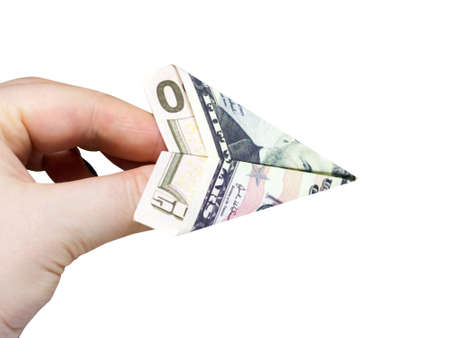 A plane made of a $50 bill in a woman's handの写真素材