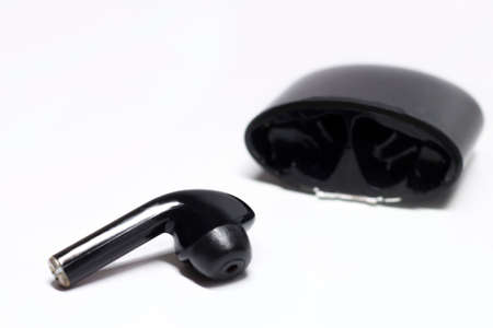 Black Wireless headphones, music gadget on a light backgroundの写真素材
