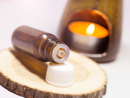 Aromatherapy oil in a bottle on a wooden background.の写真素材