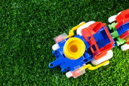 Toy color train on the grass, top viewの写真素材