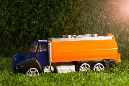 Toy truck on green grass. Copy space.の写真素材