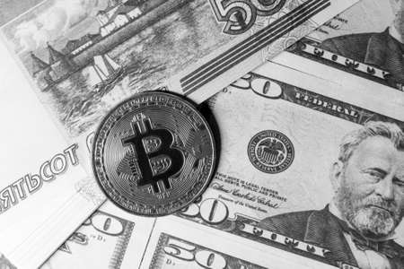 Bitcoin and cash dollar bills, investments and income, virtual money.の写真素材