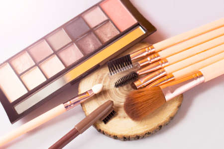 A set of makeup brushes and eye shadowの写真素材