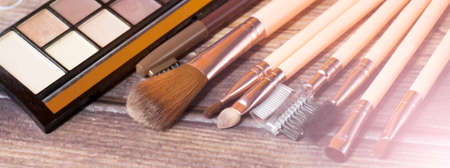 A set of makeup brushes and eye shadowの写真素材