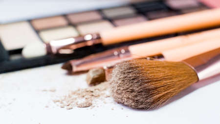 A set of makeup brushes and eye shadowの写真素材
