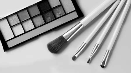 A set of makeup brushes and eye shadowの写真素材