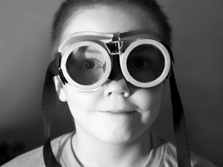Little boy in old swimming glasses, portrait of a child