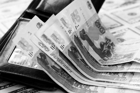 Black and white photo of a wallet full of money. Black and white photo.の写真素材