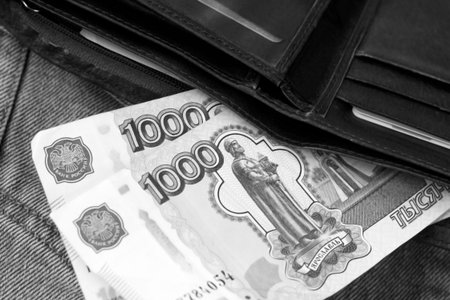 Money in the black wallet. Black and white photo. Business concept.