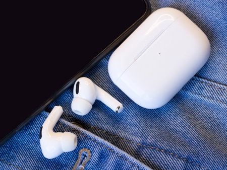 White wireless earphones, headset close