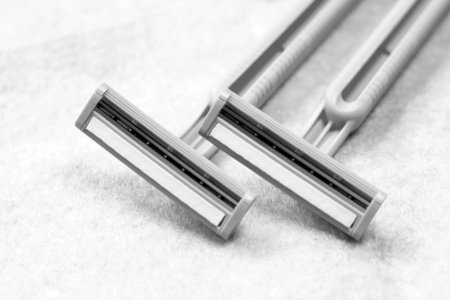 Razor blade on white background, closeup. Shaving razor