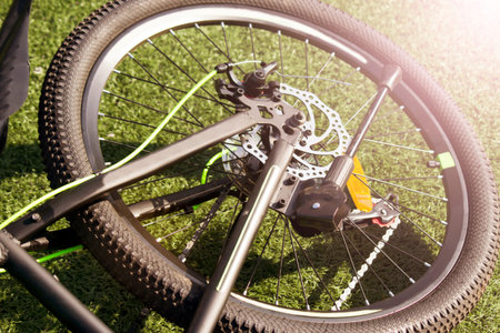 Mountain bike wheel, grass backgroundの写真素材