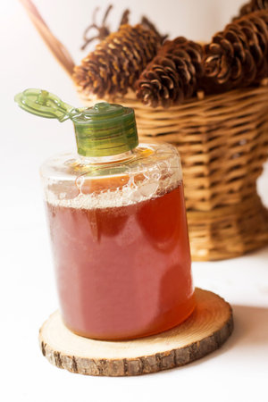 A bottle of natural honey on a white backgroundの写真素材