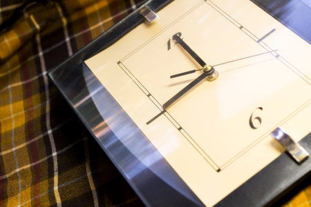 Large wall clock on a checkered fabricの写真素材