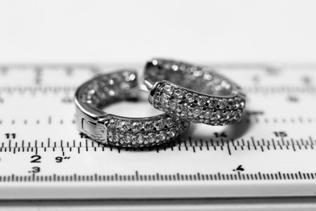 Wedding rings on a ruler. Black and white photo.の写真素材
