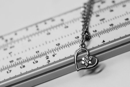 Silver pendant on a chain on a white background close-up