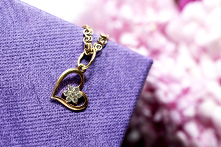 jewelry on a purple background with hydrangea flowers