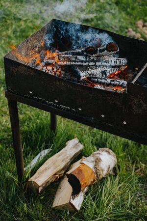 Charcoal flames up in a barbecue grillの写真素材