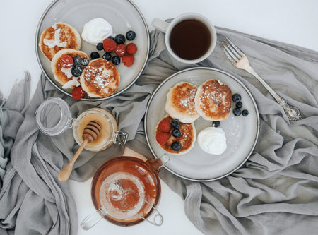 Tasty curd cheesecakes on a gray plate