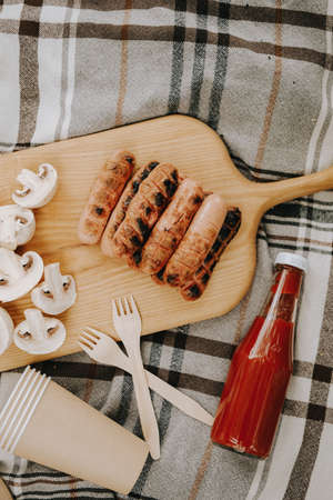 Grilled meat sausages on a grill. Picnic in the fresh airの写真素材