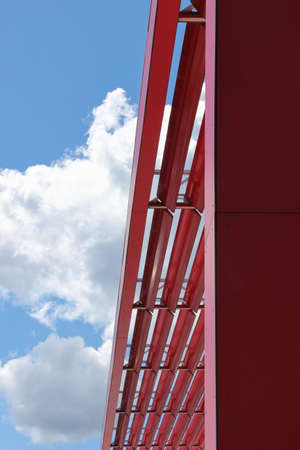 Decorative red steel construction. The metal framework at the roof of the building.の写真素材