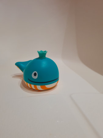 Bath toys for toddlers. Aquatic toys for funny bathing time. Whale toy that makes soap bubbles.の写真素材