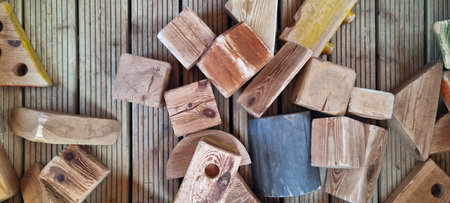Background with wooden cubes. Chaotically scattered wooden figures. Wooden toys for educational games for children.の写真素材