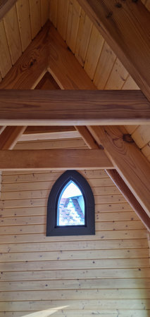 Wooden vaulted ceiling with bearing beams. Vaulted roof with exposed rafters.の写真素材