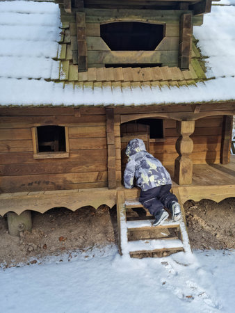 Tiny dwarf village hidden in the forest. Snow covered elf houses. Whimsical travel place. Kid exploring gnome house.の写真素材