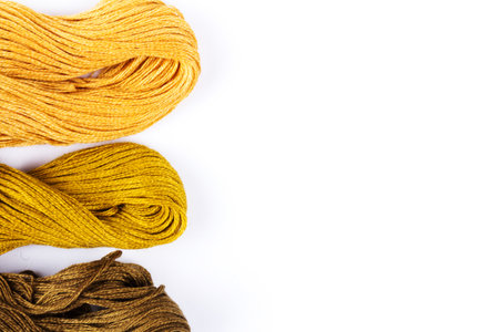 Colorful moulinet background .Bright colored skeins of floss threads on a white background.の写真素材