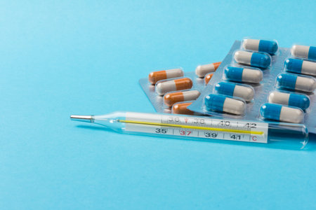 Ð¡apsules on blue background. Copy space. Global healthcare concept. Pharmaceutical industry.