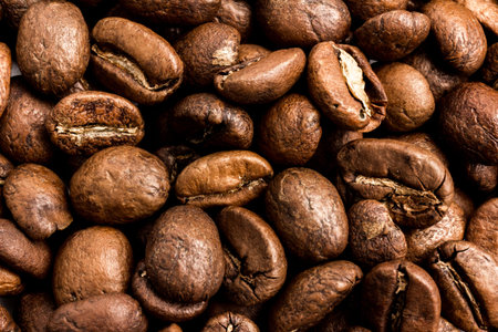 lots of beautiful roasted coffee beans in close-up. background
