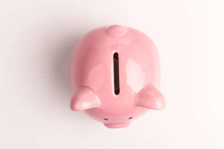 Piggy bank on white background, space for text. Finance, saving money. Business to success and saving for retirement conceptの写真素材