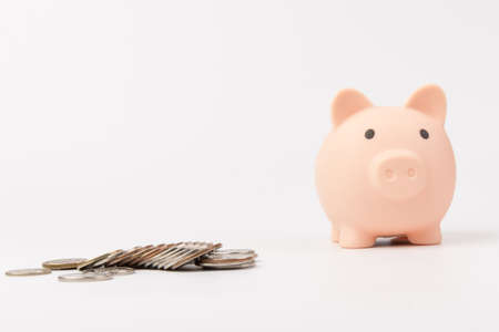 Cute Pink piggy Bank in close-up isolated on white background Saving investment budget wealth business retirement, financial, money, banking concept. Copy spaceの写真素材