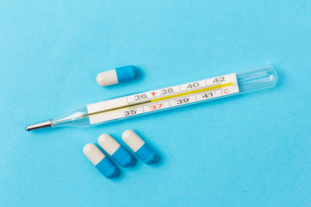 Blue and white capsules on blue background. Global healthcare concept. Antimicrobial capsule pills....