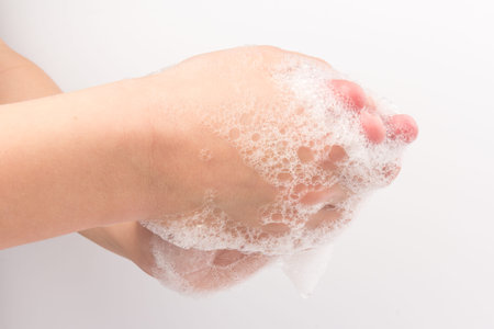 virus travel prevention. Child showing hand hygiene washing hands with soap in hot water for germs...