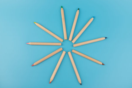 Color pencils on blue background. Back to school. Education concept
