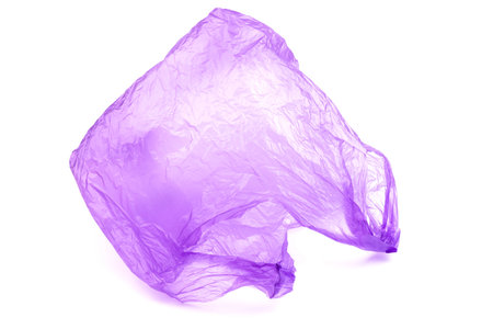 Transparent purple plastic bag with handles isolated over white backgroundの写真素材