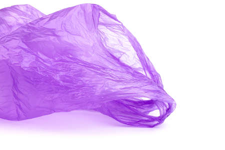 Transparent purple plastic bag with handles isolated over white backgroundの写真素材