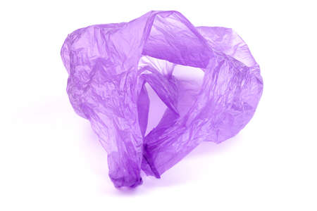 Transparent purple plastic bag with handles isolated over white backgroundの写真素材