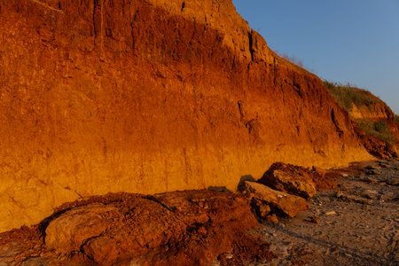Beautiful landscape, sandy cliff over the sea. Travel concept. Beautiful nature texture