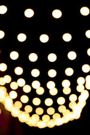 Blurred sparks from fire in front of black backgound. Christmas and New Year holidays concept....